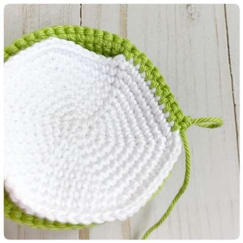 Original crochet frog tutorial photo 4, showing the belly and body being joined and stuffed.