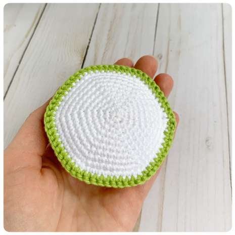 Original crochet frog tutorial photo 7, showing the belly and body being joined and stuffed.