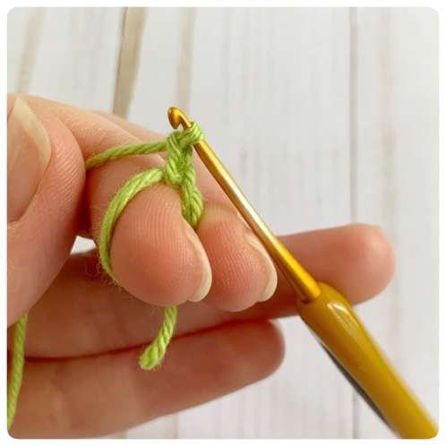 Original crochet frog tutorial photo 14, showing the little crochet paws and toes.