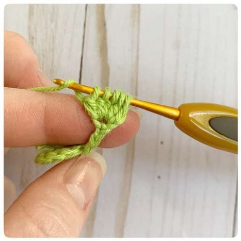 Original crochet frog tutorial photo 17, showing the little crochet paws and toes.