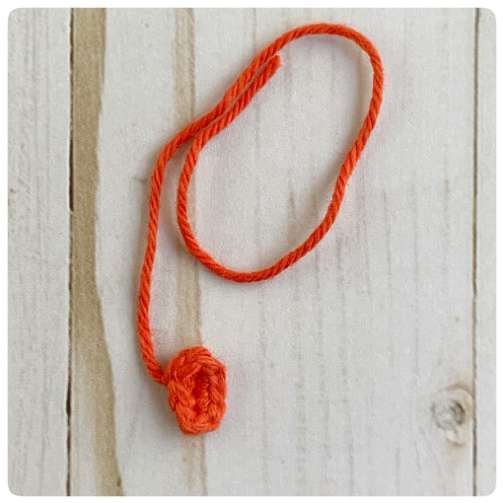 Original crochet frog tutorial photo 24, showing the small tongue worked from a chain.